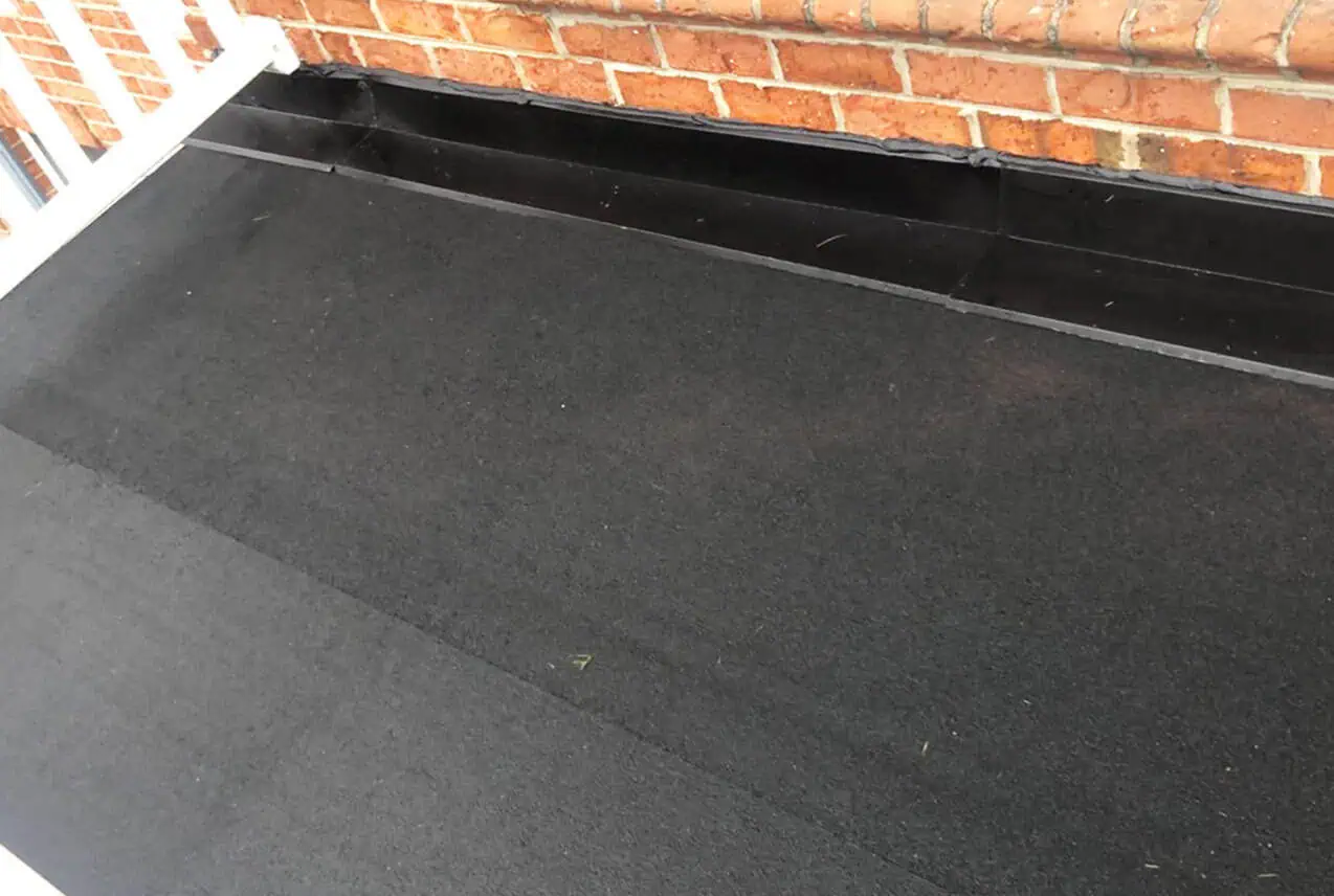 Asphalt shingle roof replacement in progress